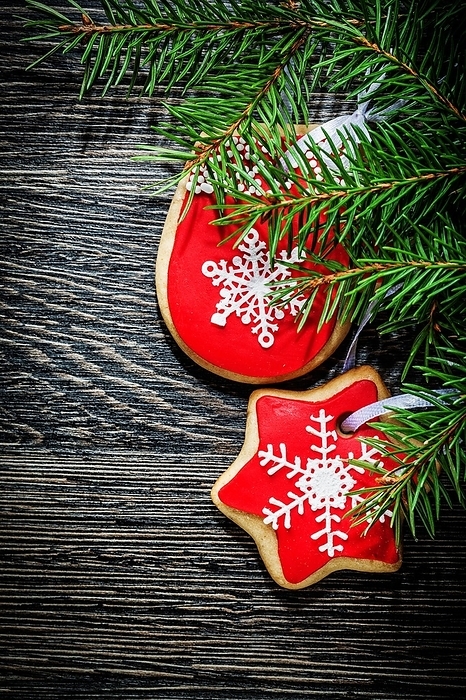 Fir branch Christmas biscuits on a wooden board, by Dzmitri Mikhaltsow