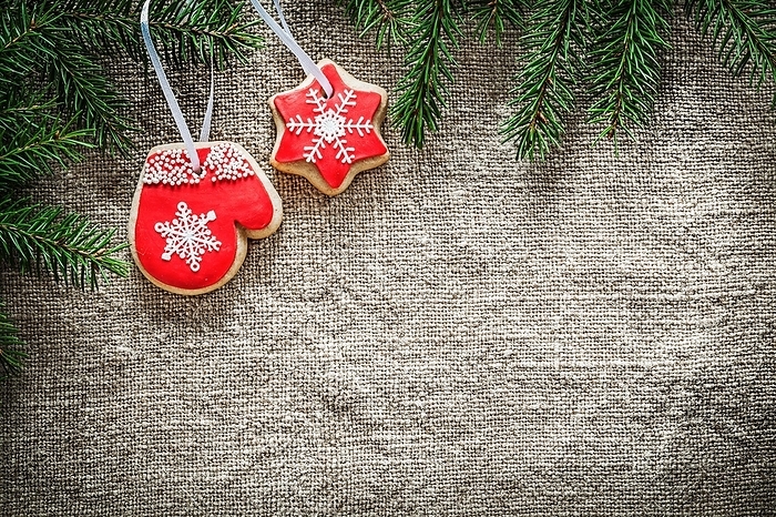 Fir branches gingerbread on burlap background, by Dzmitri Mikhaltsow