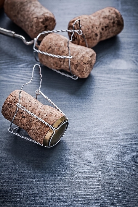 Four corks of champagne with wires, by Dzmitri Mikhaltsow