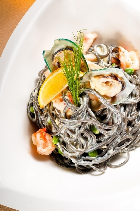 Fresh seafood black squid ink coulored spaghetti pasta tipycal italian food, food photography, food photography, by keko64