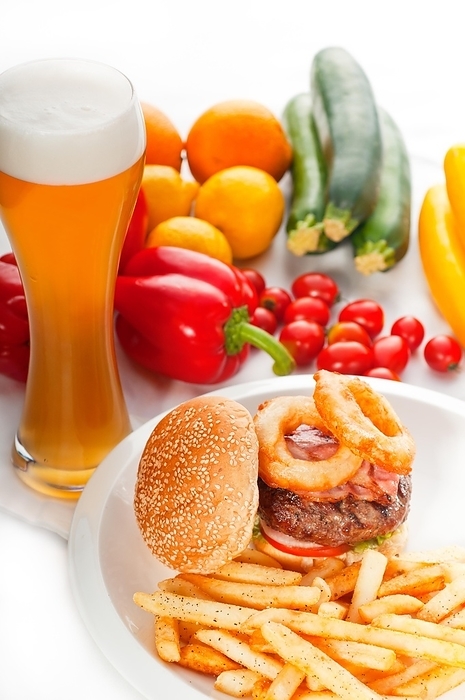 Classic american hamburger sandwich with onion rings and french fries, glass of beer and fresh vegetables on background, MORE DELICIOUS FOOD ON PORTFOLIO, food photography, by keko64
