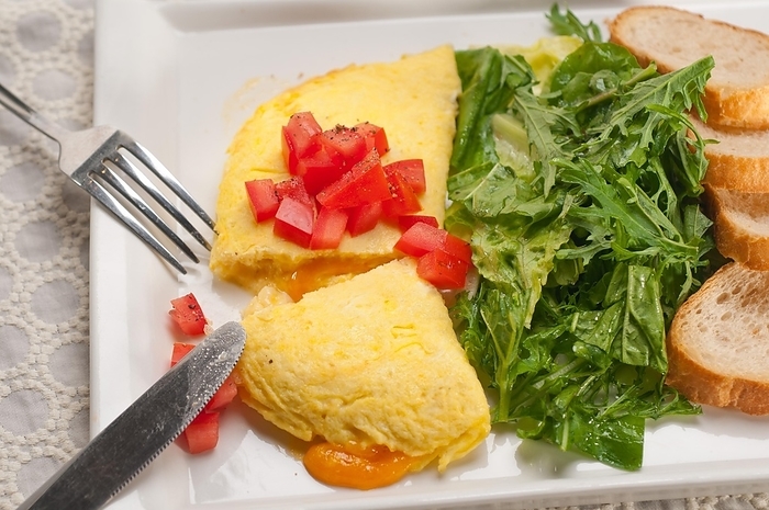 Home made omelette with cheese tomato and rucola rocket salad arugola, by keko64