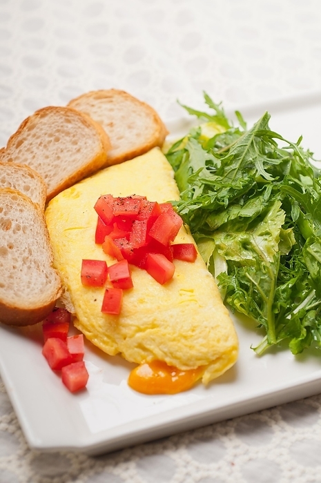 Home made omelette with cheese tomato and rucola rocket salad arugola, by keko64