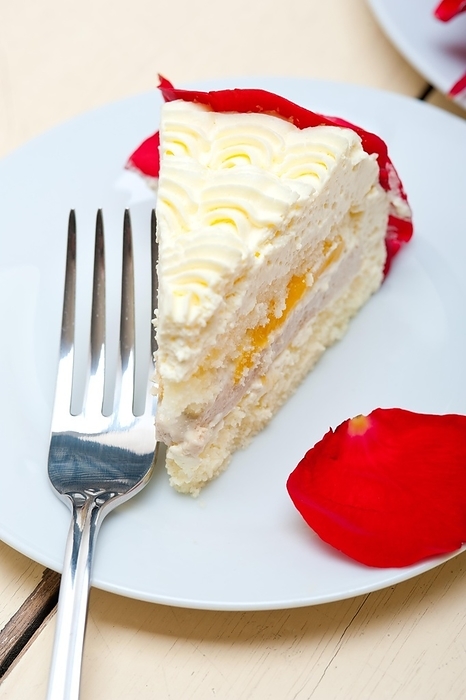 Whipped cream mango cake with red rose petals, food photography, by Francesco Perre