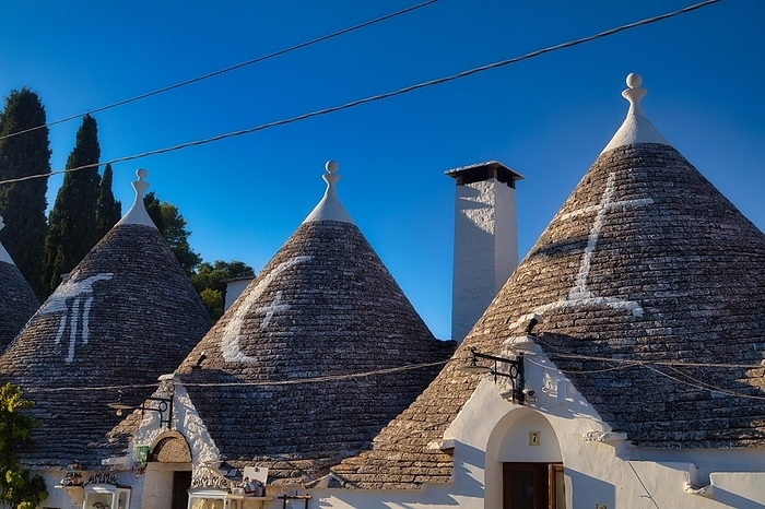 Trulli with symbols on the roof, Alberobello, Valle d'Itria, Apulia, Italy, Europe, by Hartmut Albert
