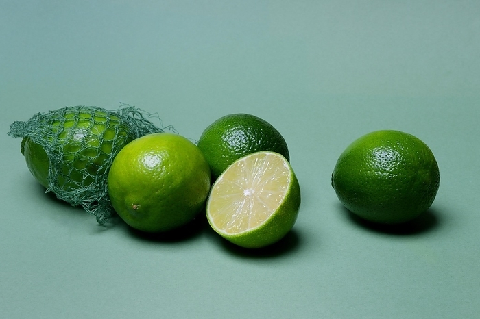 Limes with packing net, citrus fruits, by Jürgen Pfeiffer