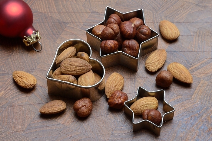 Nuts and cookie cutters, almonds and hazelnuts, by Jürgen Pfeiffer