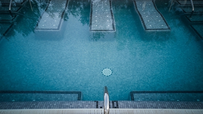 Swimming pool in a hotel with a relaxation zone, by Przemysław Ceglarek