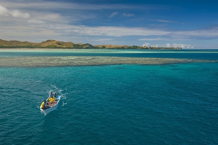 Little boat in the blue lagoon, Yasawas, Fiji, South Pacific, Oceania, by Michael Runkel