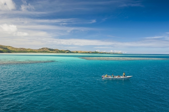Little boat in the blue lagoon, Yasawas, Fiji, South Pacific, Oceania, by Michael Runkel