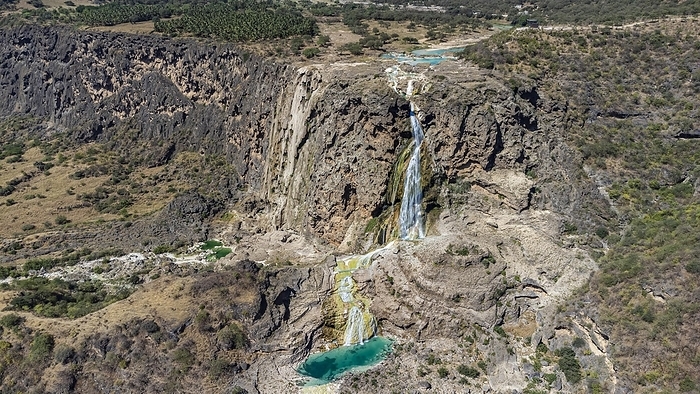 Aerial of a turquoise waterfall, Wadi Darbat, Salalah, Oman, Asia, by Michael Runkel
