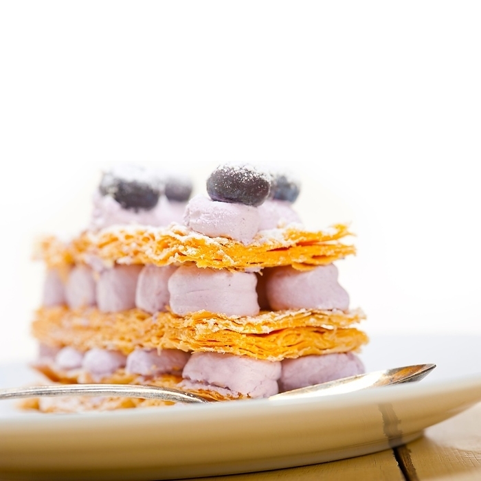 Fresh baked napoleon blueberry and cream cake dessert, by Francesco Perre