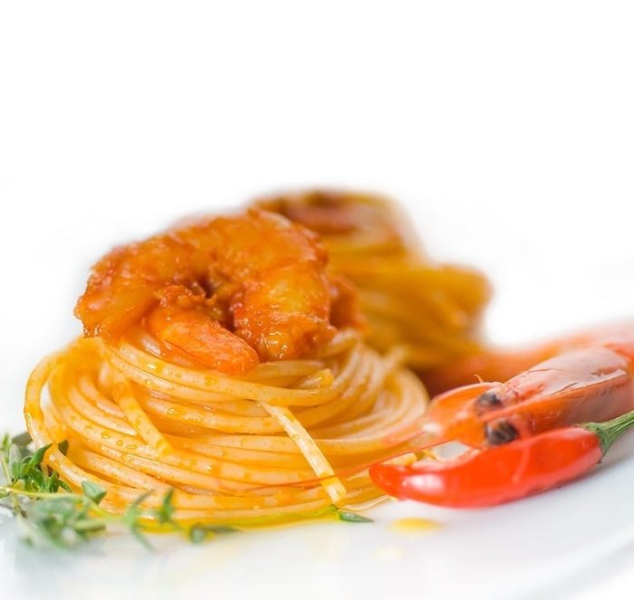 Italian spaghetti pasta and fresh spicy shrimps sauce over white, by keko64