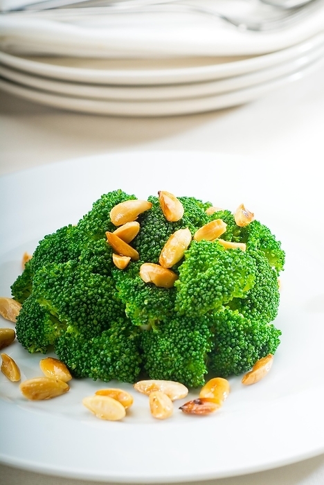 Fresh and vivid sauteed broccoli and almonds very ealthy food, by keko64