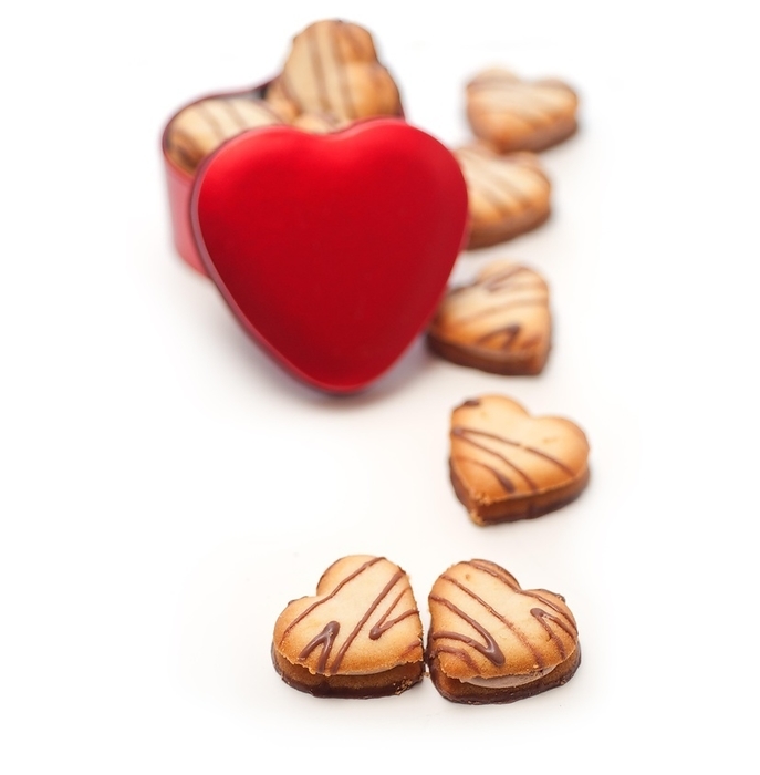 Heart shaped cream cookies on red heart metal box, by keko64