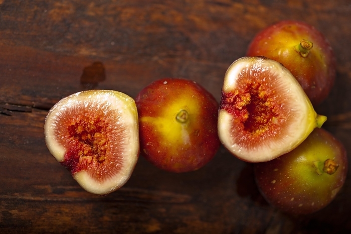 Fresh figs macro closeup over old wood boards, by Francesco Perre