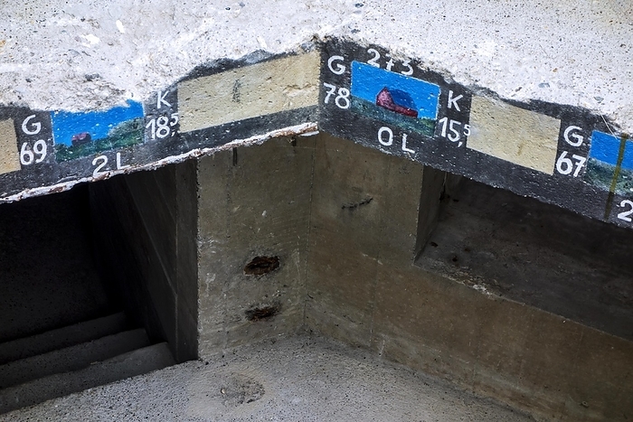 Range finding coordinates and images of landscape elements painted on upper edge of German World War Two bunker at Utah Beach, Normandy, France, Europe, by alimdi / Arterra / Philippe Clément