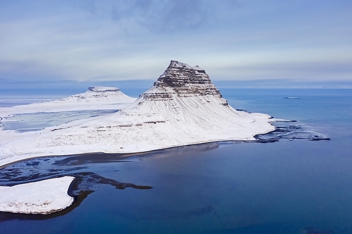 Iceland Aerial view over Kirkjufell, nunatak hill covered in snow on the Sn fellsnes peninsula in winter, most photographed mountain in Iceland, by alimdi   Arterra   Sven Erik Arndt