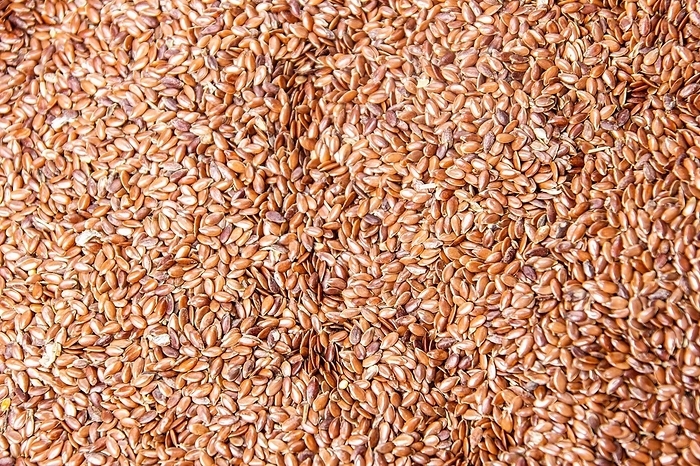 A huge amount of flax seeds, superfood, healthy eating, fitness, by Mikalai Sayevich