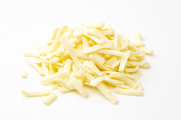Melted cheese on white background