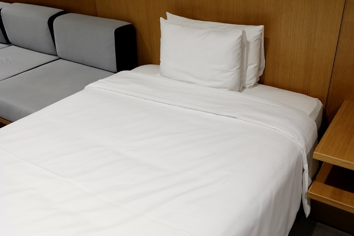 A pure white bed in a hotel