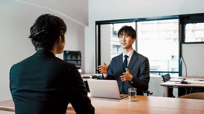 A Japanese man in human resources conducting personal interviews and interviews in an office for a job interview at a small to medium-sized company (人)