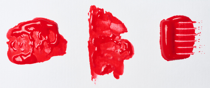 Watercolor brush stroke of red paint on a white isolated background, close up Watercolor brush stroke of red paint on a white isolated background, close up