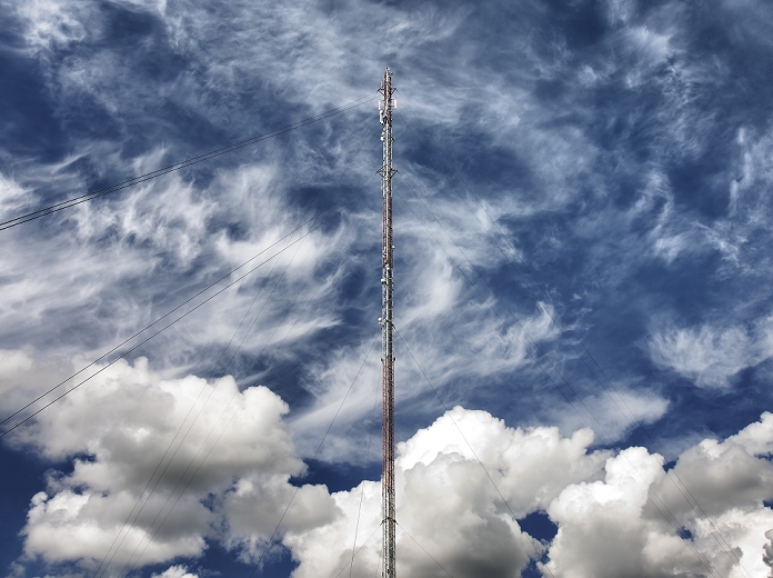 A tall thin metal cell phone mast, an antenna for transmitting the signal for electronic equipment, including phones.