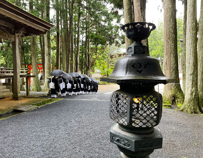 Koyasan Lanterns and a procession of monks in the back
