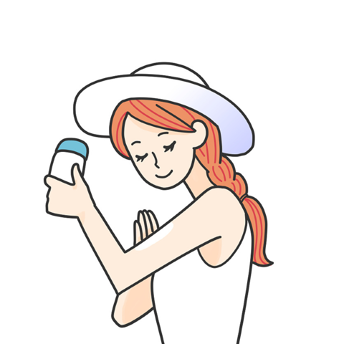 Woman applying sunscreen cream