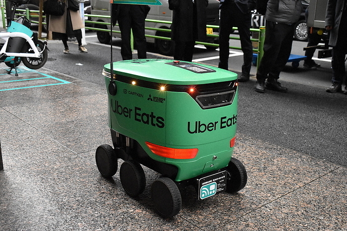 Uber Eats robot delivery Demonstration run in Tokyo An UberEats delivery robot traveling on a sidewalk in Chuo ku, Tokyo  photo by Yuko Shimada.