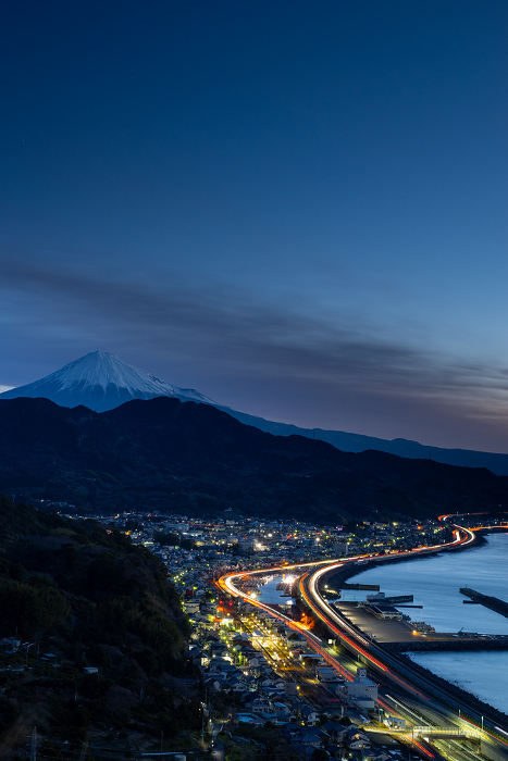 Fuji before dawn and the light trail of cars Satta Pass