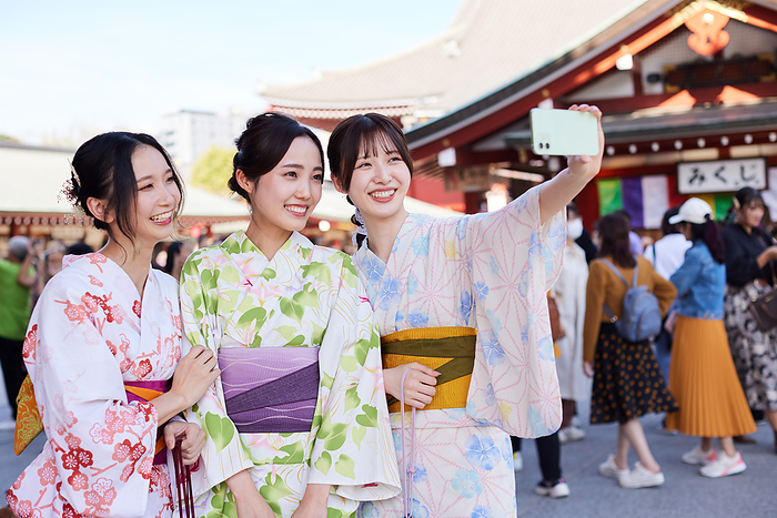 Japanese woman in yukata taking a selfie