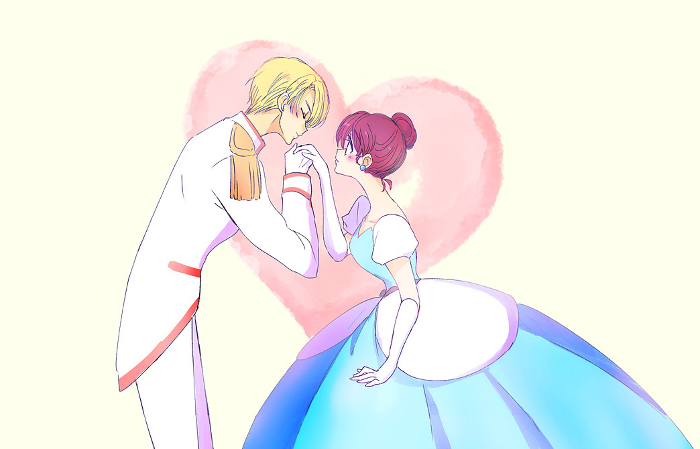 Prince kissing the back of the princess's hand
