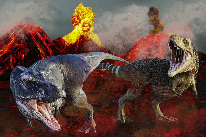 Two Tyrannosaurs are startled by a volcanic explosion and flee