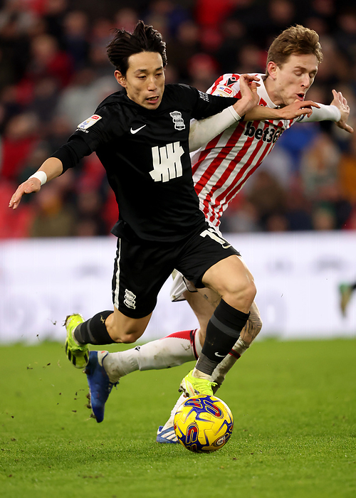 Stoke City v Birmingham City   Sky Bet Championship  Koji Miyoshi of Birmingham City and Wouter Burger of Stoke City challenge during the Sky Bet Championship match between Stoke City and Birmingham City at Bet365 Stadium on January 20, 2024 in Stoke on Trent, United Kingdom.   WARNING  This Photograph May Only Be Used For Newspaper And Or Magazine Editorial Purposes. May Not Be Used For Publications Involving 1 player, 1 Club Or 1 Competition Without Written Authorisation From Football DataCo Ltd. For Any Queries, Please Contact Football DataCo Ltd on  44  0  207 864 9121