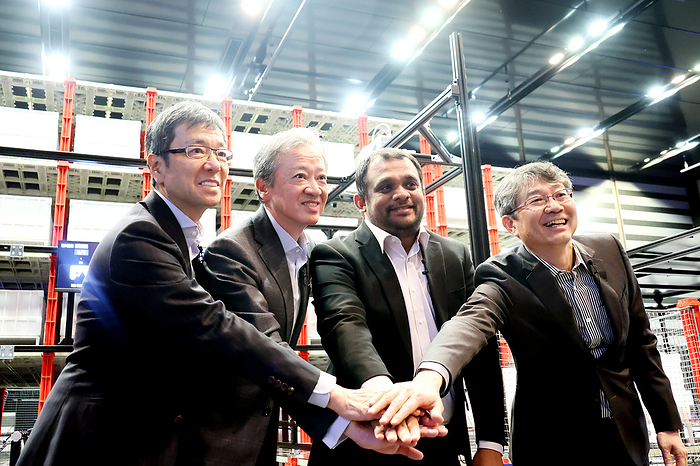 Panasonic Connect and Rapyuta Robotics display a warehouse logistics solution March 8, 2024, Tokyo, Japan   Panasonic Connect president Yasuyuki Higuchi  L , Panasonic Connect vice president and CTO Akira Sakakibara  2nd L  and Rapyuta Robotics founder and CEO Gajan Mohanarajah  2nd R  pose for photo as they display a warehouse logistics solution with robots at the Panasonic Connect headquarters in Tokyo on Friday, March 8, 2024. Panasonic Connect and Rapyuta Robotics will collaborate to launch the warehouse logistics solutions in Japanese market in this year.     photo by Yoshio Tsunoda AFLO 