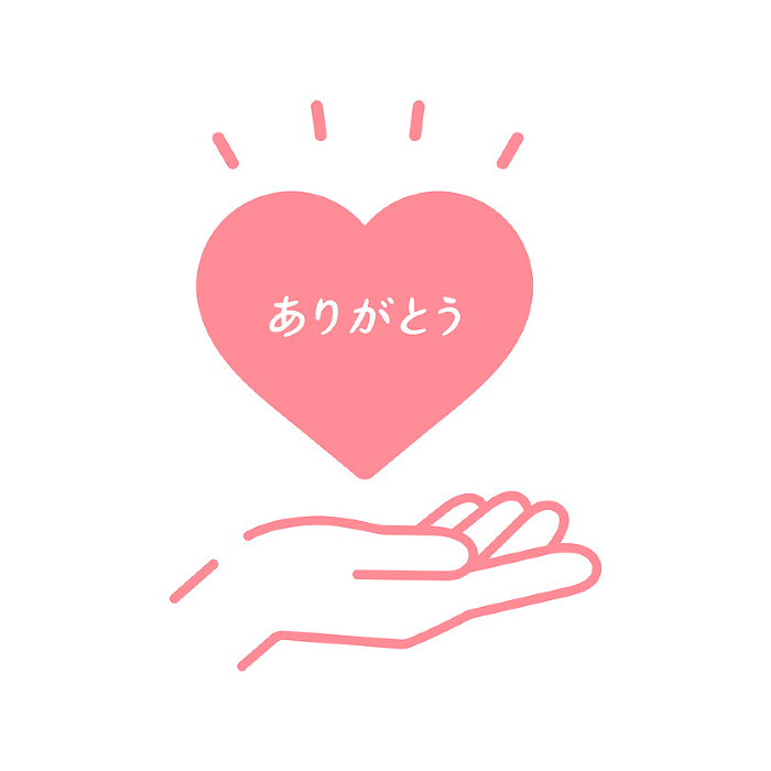 Human hand holding a pink heart with the word 