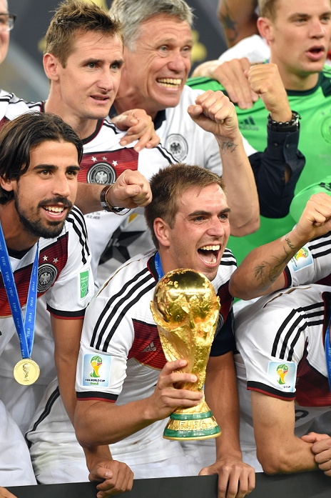 2014 FIFA World Cup Final Germany Wins 4th title in 6 tournaments Germany team group  GER , JULY 13, 2014   Football   Soccer : Philipp Lahm of Germany holds the trophy as he celebrates with his teammates Sami Khedira and Miroslav Klose after winning the FIFA World Cup Brazil 2014 Final match between Germany 1 0 Argentina at Estadio do Maracana in Rio De Janeiro, Brazil.  Photo by FAR EAST PRESS AFLO 