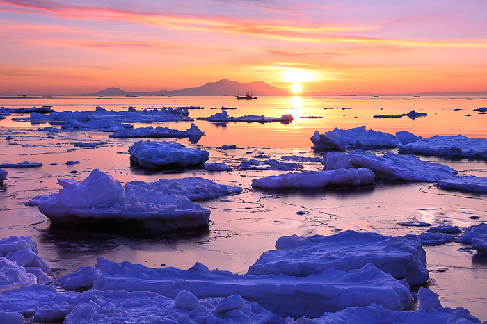 Sunrise drift ice and fishing boats Hokkaido