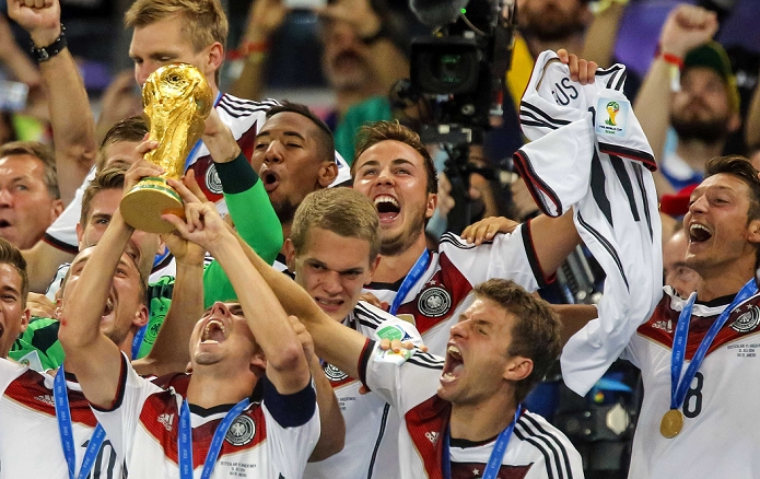 2014 FIFA World Cup  Final Germany Wins 4th title in 6 tournaments Mario Gotze  GER , JULY 13, 2014   Football   Soccer : Germany s Mario Gotze celebrates with the jersey of injured countryman Marco Reus after winning the FIFA World Cup 2014 final soccer match between Germany 1 0 Argentina at the Estadio do Maracana in Rio de Janeiro, Brazil.  Photo by AFLO 