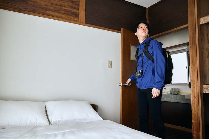 Japanese man entering a room