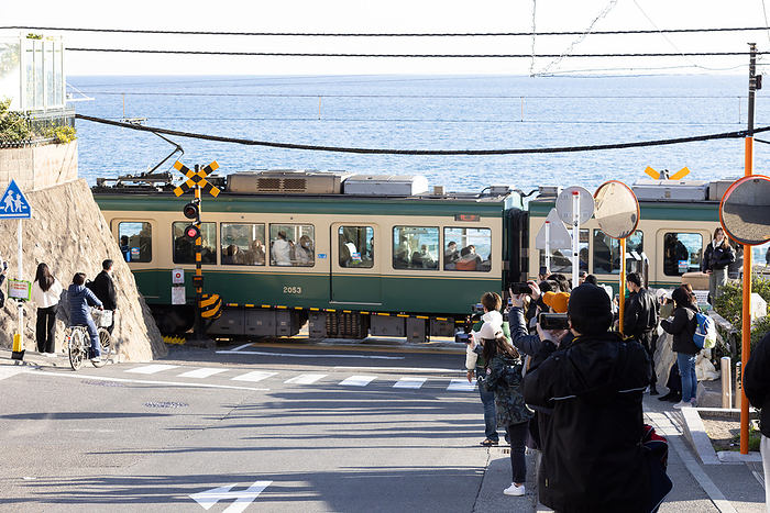 Overtourism in Kamakura, Japan Tourists are taking photos around the railroad crossing at Enoden s Kamakura Kokomae Station in Fujisawa City, Kanagawa Prefecture on February 28, 2024.  This railroad crossing is featured in the world famous Japanese anime series  Slam Dunk . It is a popular tourist destination for domestic and foreign tourists to visit and take photos.  However, due to the large number of tourists visiting, the Enoden train has become extremely crowded, and residents living along the line have been affected by the problem of overtourism.  Photo by Yosuke Tanaka AFLO 