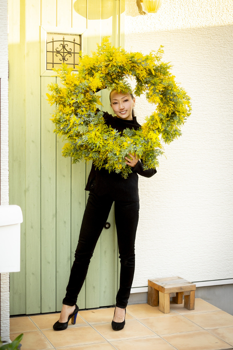 Woman with mimosa wreath