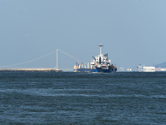 Akashi Kaikyo Bridge and ships seen from Osaka Port