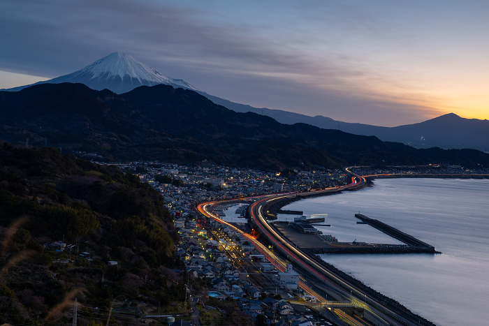 Morning glow, Mt. Fuji, and the light trail of automobiles Satta Pass