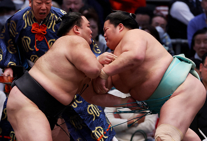 Spring Grand Sumo Tournament, Day 2 Asanoyama attacks Kotonowaka  right  at the Edion Arena Osaka on March 11, 2024.