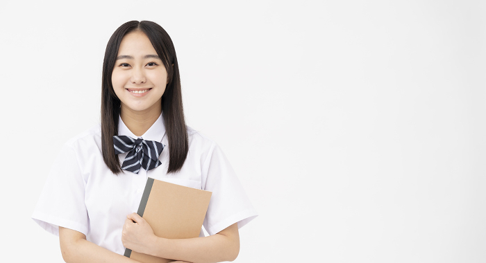 Japanese high school girl in short-sleeved school uniform/white back (People)