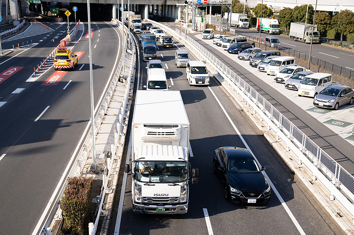 2024 problem for the logistics industry in Japan Trucks and the other vehicles drive on Metropolitan Expressway in Tokyo, on February 8, 2024.   In the transportation industry, new regulations will be appiled from April 2024 that will limit overtime work for truck drivers to 960 hours a year. There are concerns that this will lead to a lack of transportation capacity and the impact it will have on logistics, and this is so called  2024 problem  for the logistics industry in Japan.  Photo by AFLO    