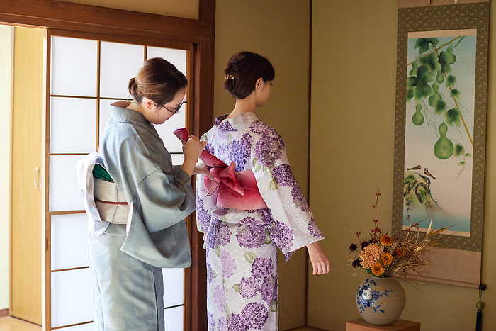 Japanese woman getting dressed